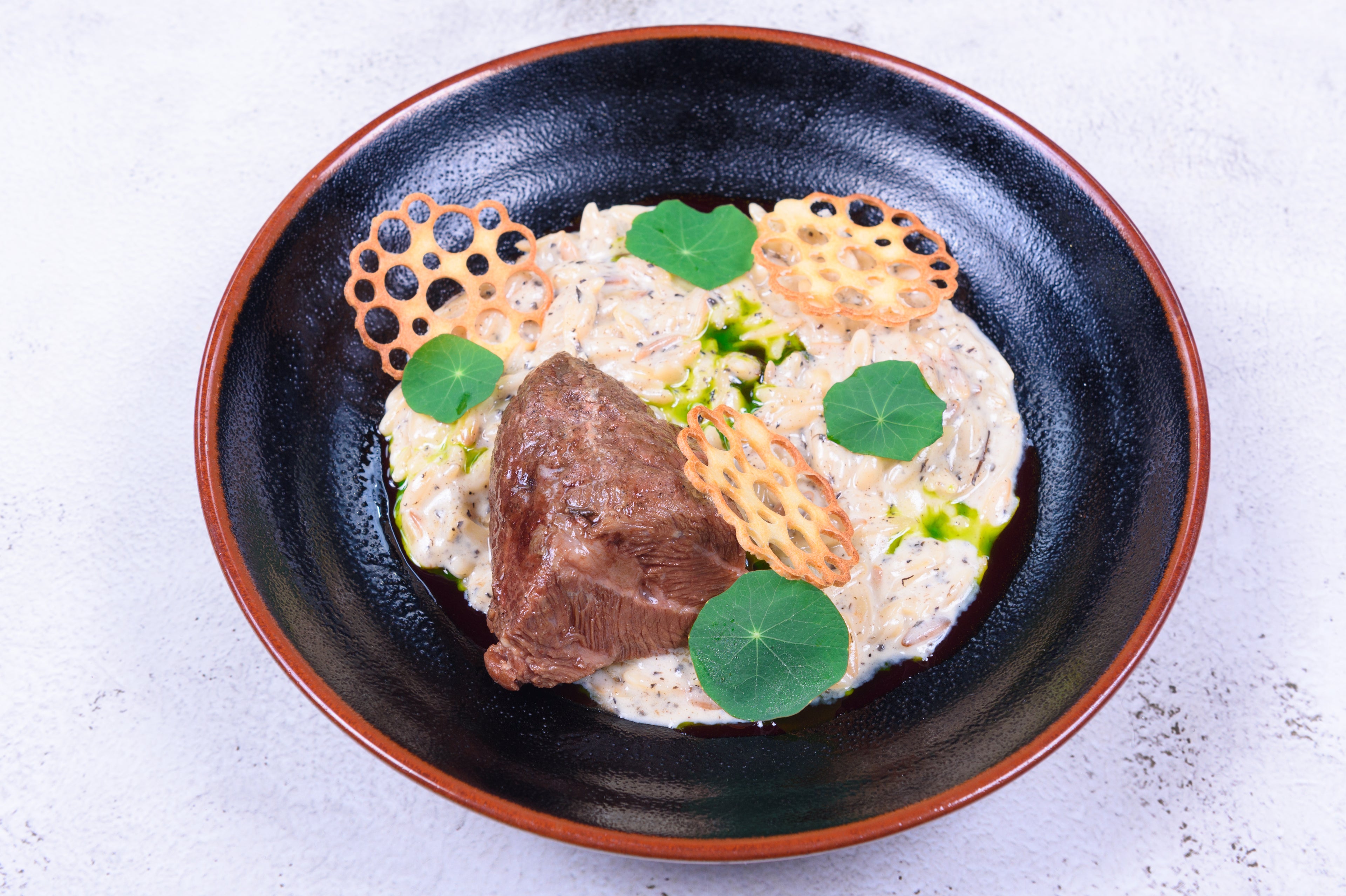Orzo with truffle sauce and beef cheeks